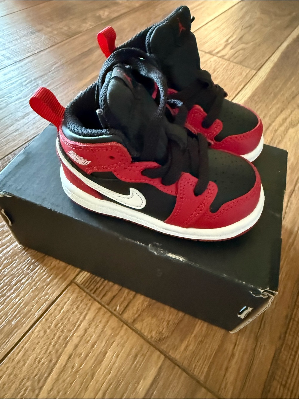 Nike Jordan Black and Red High-Top Sneakers with White Swoosh